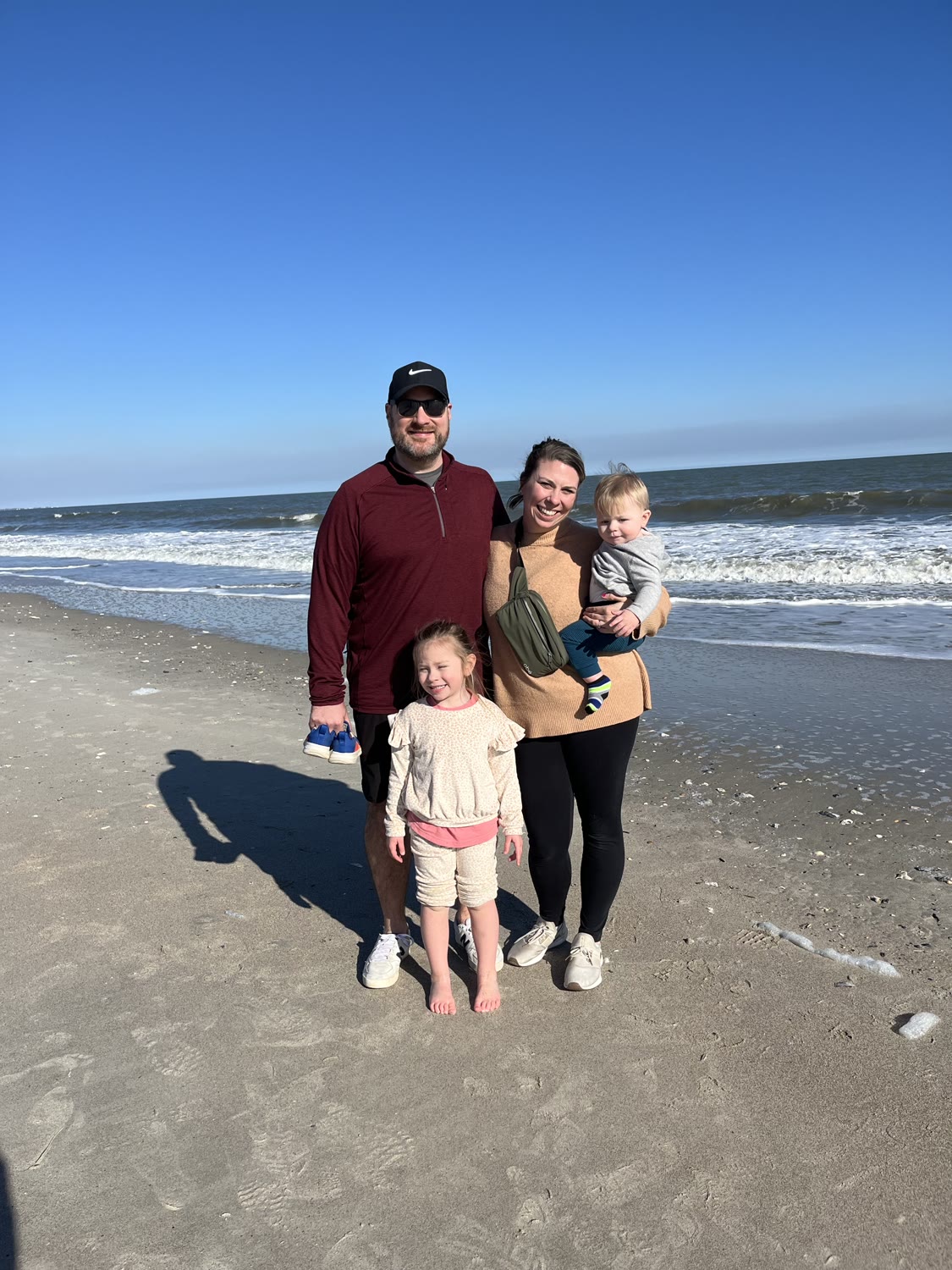 The Krezmien family together on the beach