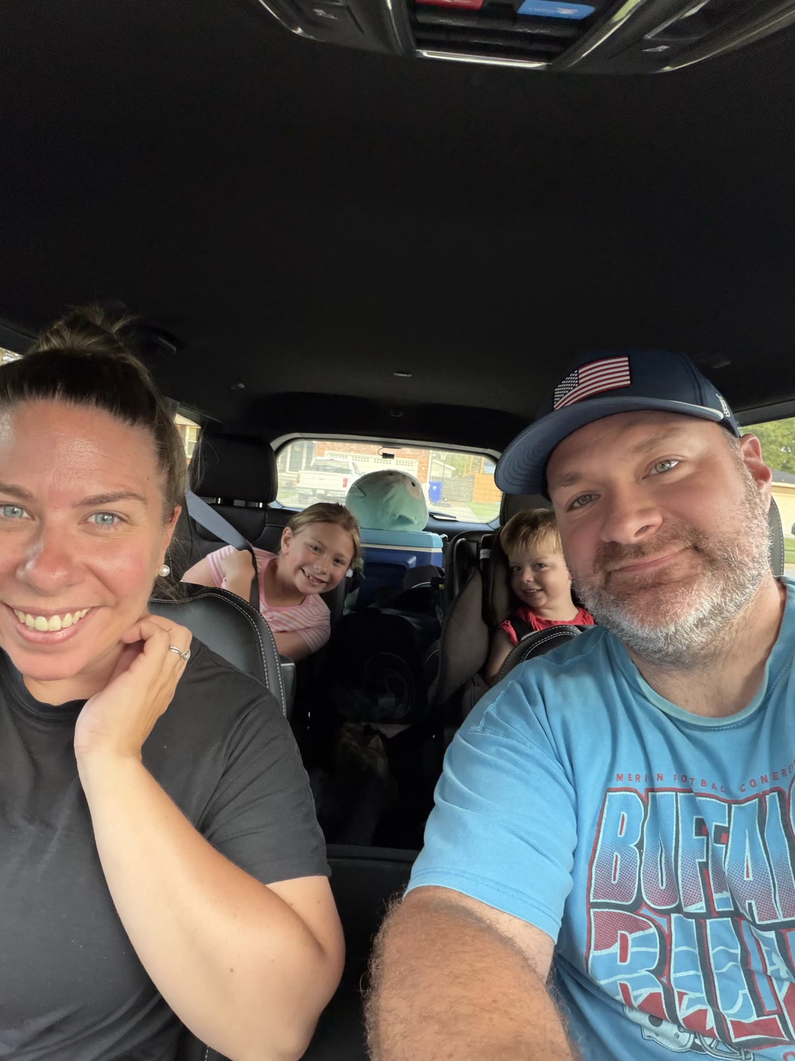 Jake Krezmien with his wife and two kids on a family drive